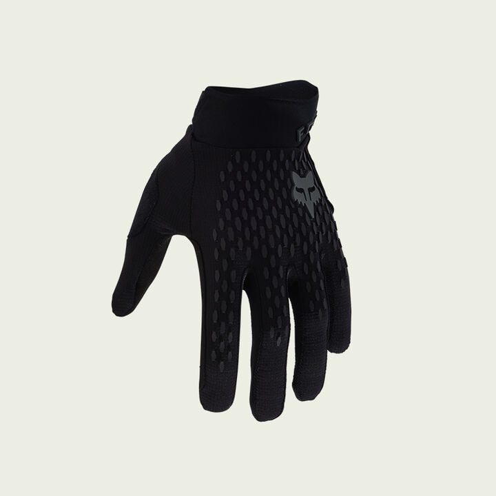 dark mtb glove on green background