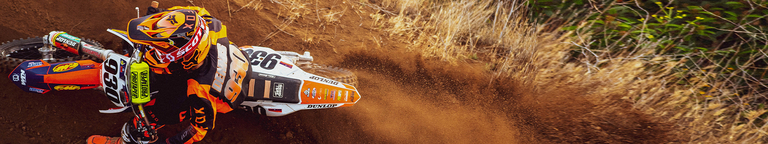 Youth on a motocross bike wearing Fox Youth Moto products
