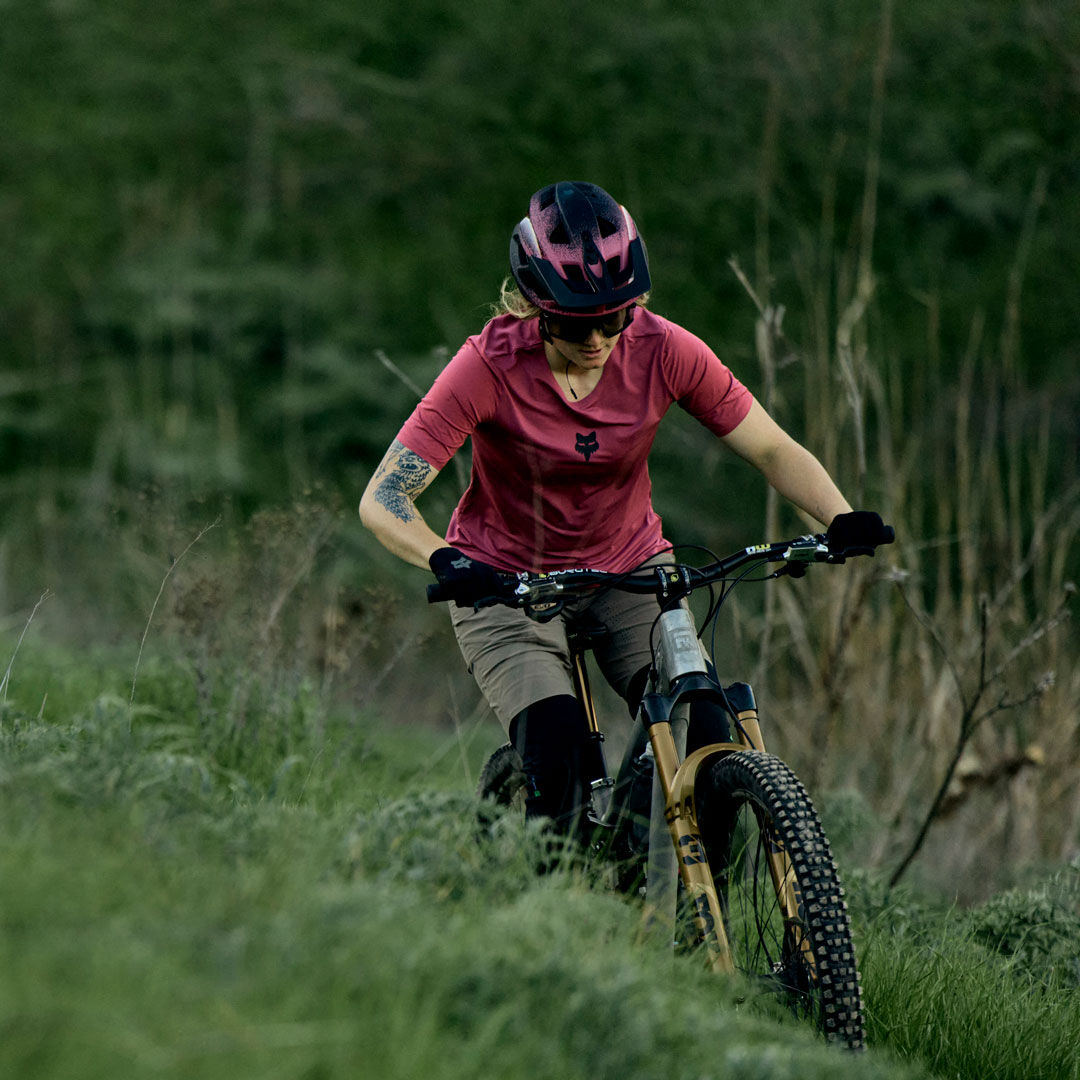 woman riding down a trail in flexair gear